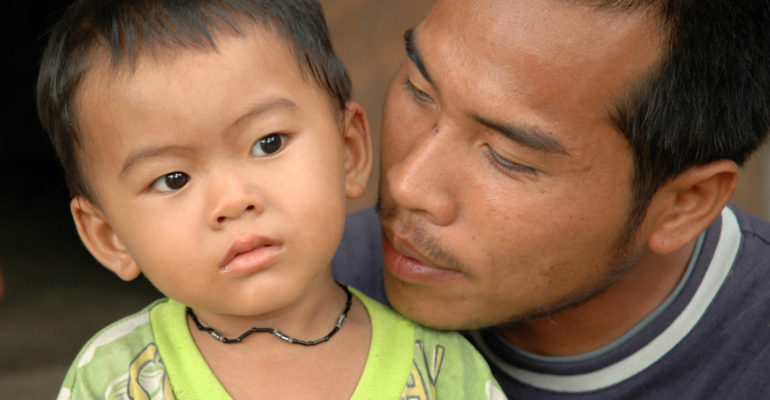 Burmese migrant with a son